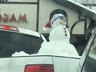 Snowman riding in truck